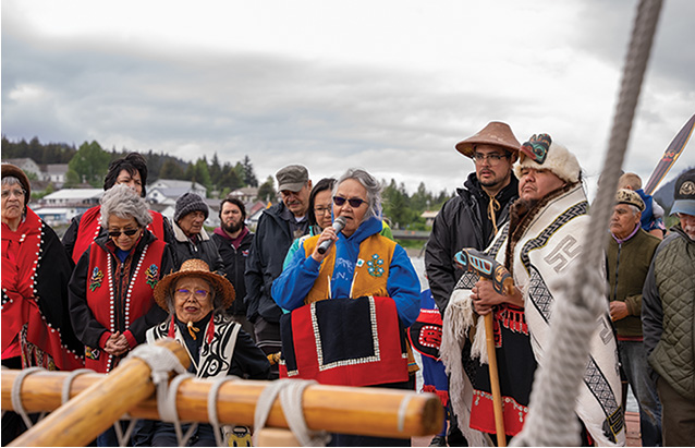 a group of people standing on a boat