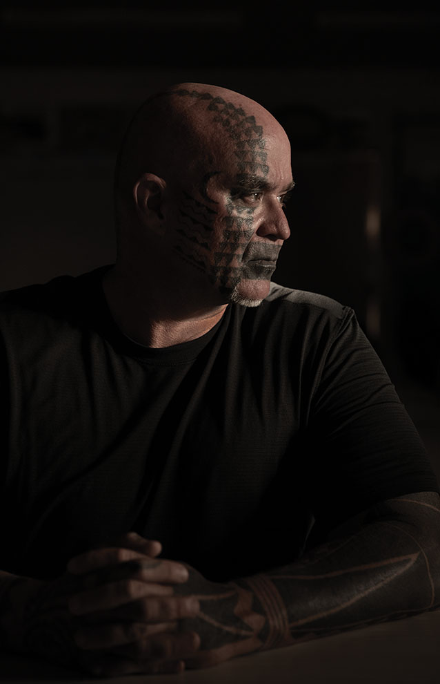 a person with a tattoo on his face