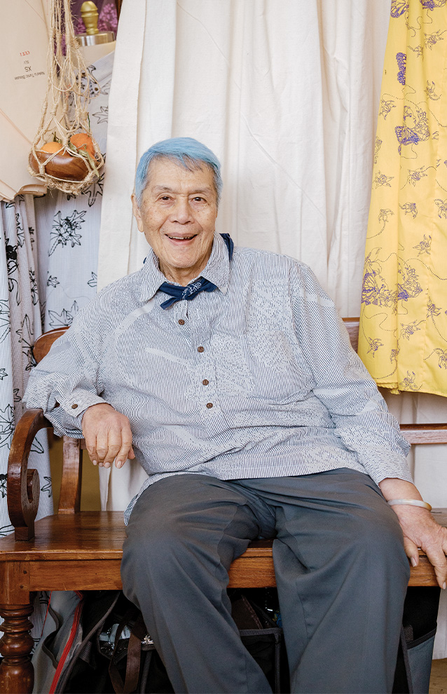 a photo of an elderly person sitting on a bench