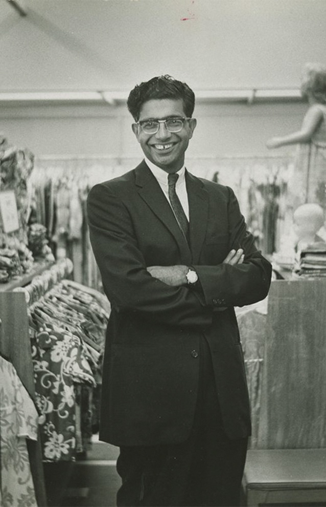 an old photograph of a person wearing a tailored suit