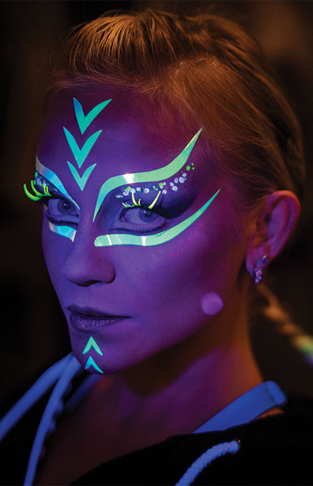 a person with glow in the dark face paint