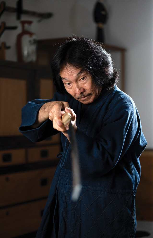 person holding up a sword