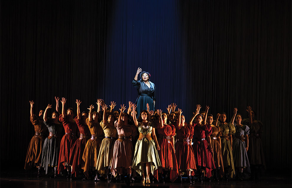 large group of people on stage performing