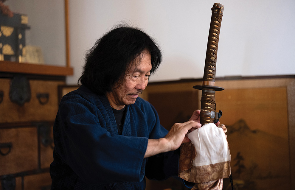 person tending to a sword